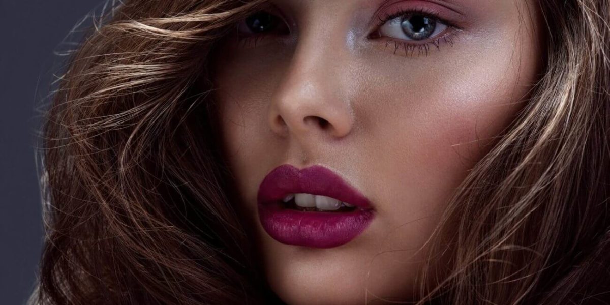 face-of-a-beautiful-woman-with-long-brown-curly-hair--e1621501950166