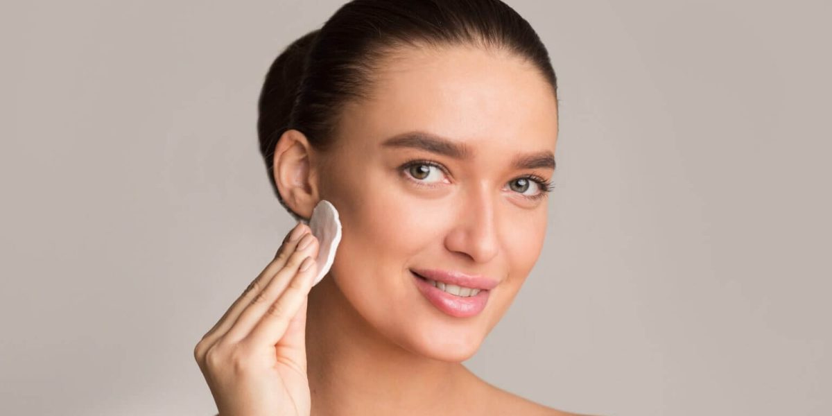 millennial-girl-with-perfect-skin-removing-make-up-with-cotton-pad-1536x987